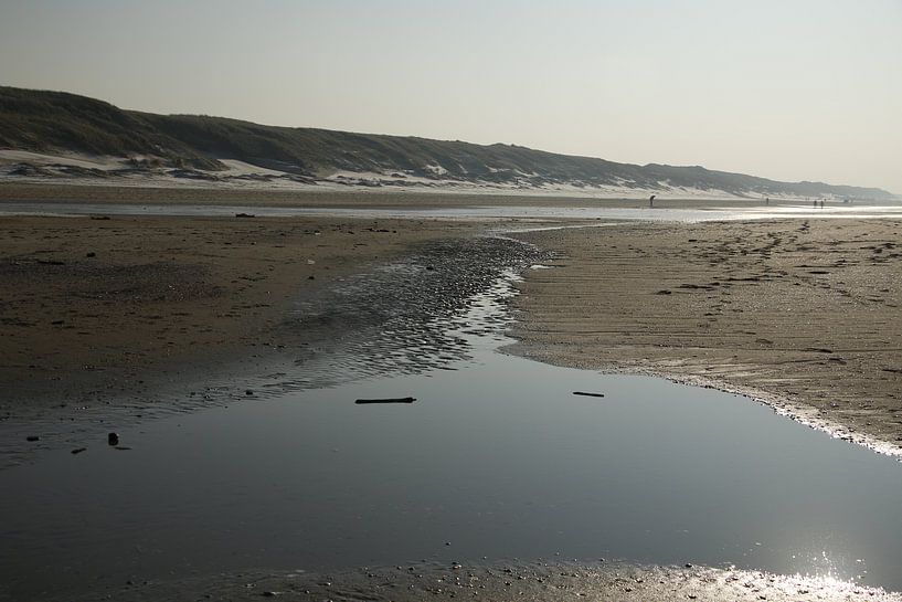 trickle of water on the beach by Cora Unk
