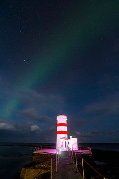 Aurora Borealis mit Leuchtturm von Freek van den Driesschen