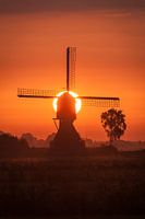 mill with rising sun