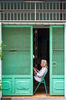 Woman Reading the Newspaper - Ho Chi Minh City
