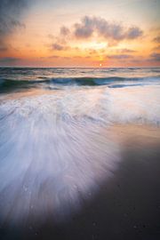 Sunset at the North Sea with waves rolling on the beach by Daniel Pahmeier