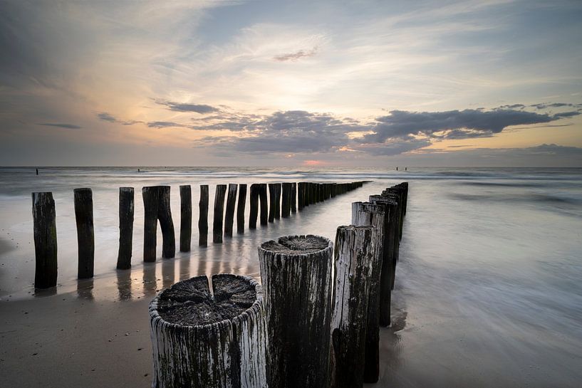 Sunset at Domburg&#039;s old breakwaters by Raoul Baart