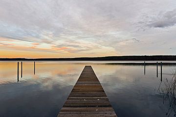 The sky is reflected in the wintry lake water