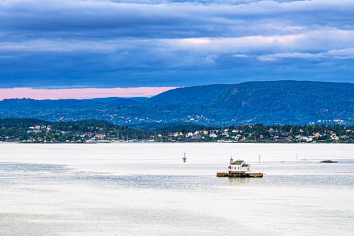 A lighthouse in the Oslofjord near Oslo, Norway, in the morning
