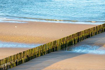 A deserted beach at Zoutelande with a row of breakwaters by Kim Willems
