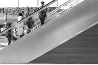 Four ladies on an escalator.