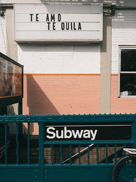 TE AMO TEQUILA quote on exit sign above a New York subway station