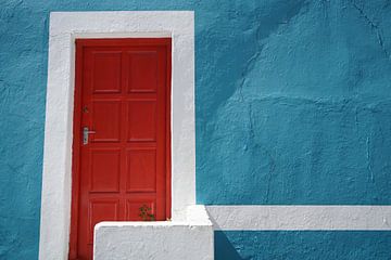 Red door in blue wall in colourful Bo-Kaap,Cape Town