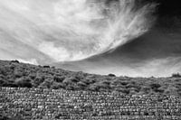 Black and white photo of a piece of landscape with wall and interesting play of lines
