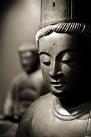 Head of a stone Buddha statue in sepia