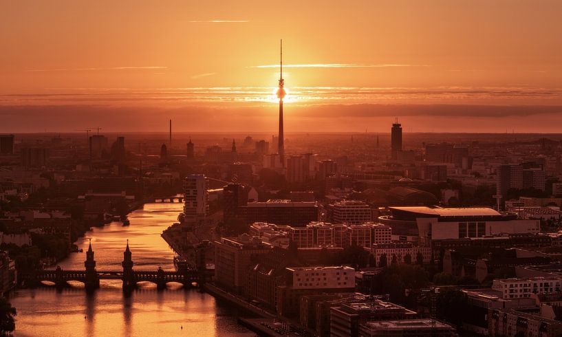 Berlin skyline with sunset behind the television tower by Jean Claude Castor