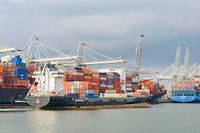Cargo ship with containers leaves the port of Rotterdam