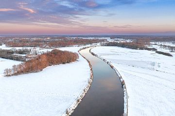 Vecht river flowing through a snowy winter landscape during suns by Sjoerd van der Wal Photography