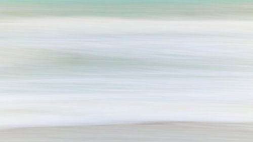 At the beach. Soft hues of the North Sea waves in the winter morning light. Aspect ratio 16:9