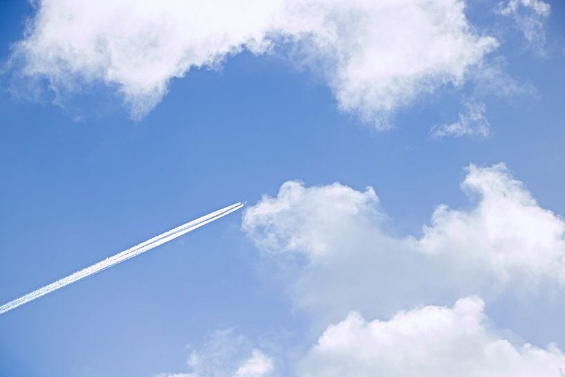 Cloudy sky with airplane by Maarten Borsje