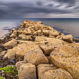Rocky coastal scene under grey sky by Chris Stenger