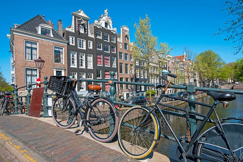 Cycling on the canals in Amsterdam by Eye on You