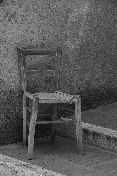 Italian chair in a deserted street (black and white) by Jari L.