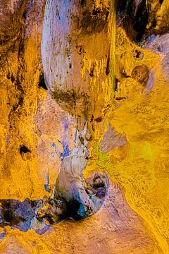 A gnome squats under a stalactite in a dripstone cave. by kall3bu