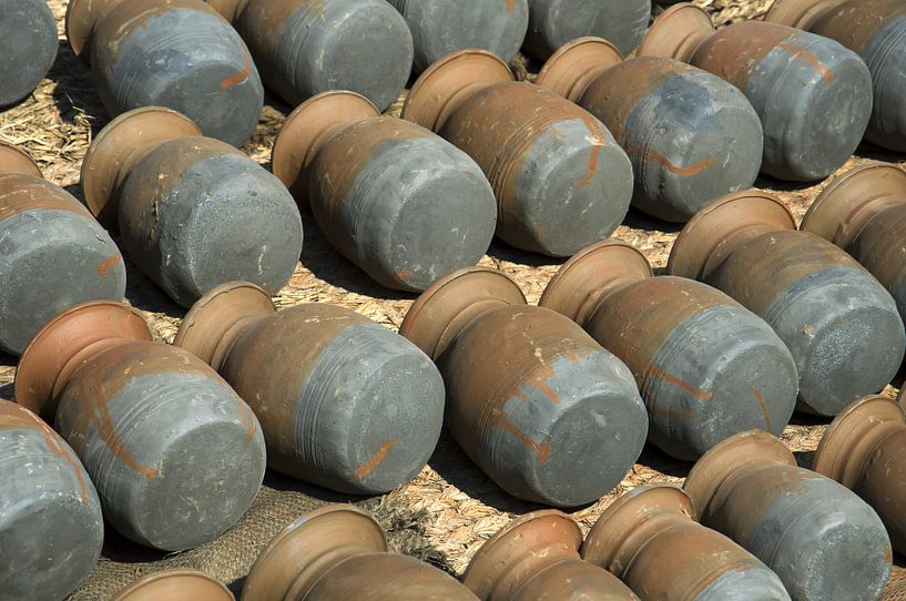 Bottom of potsBhaktapur, Nepal: Pottery Square. Symmetrical rows of traditional pots by Michael Semenov