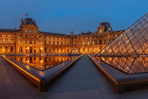 Louvre Museum reflected in the water