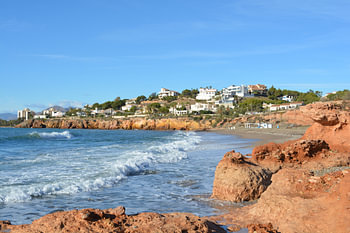 white village on a mountain by the mediterranean sea