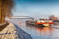 Barge passes open bridge at Dorkwerd
