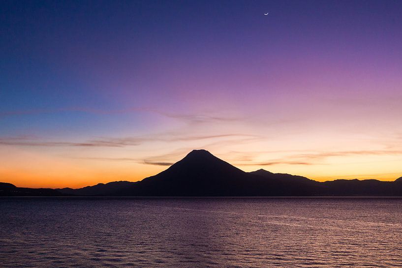 Volcano during sunset at lake Atitlan in Guatemala by Michiel Ton