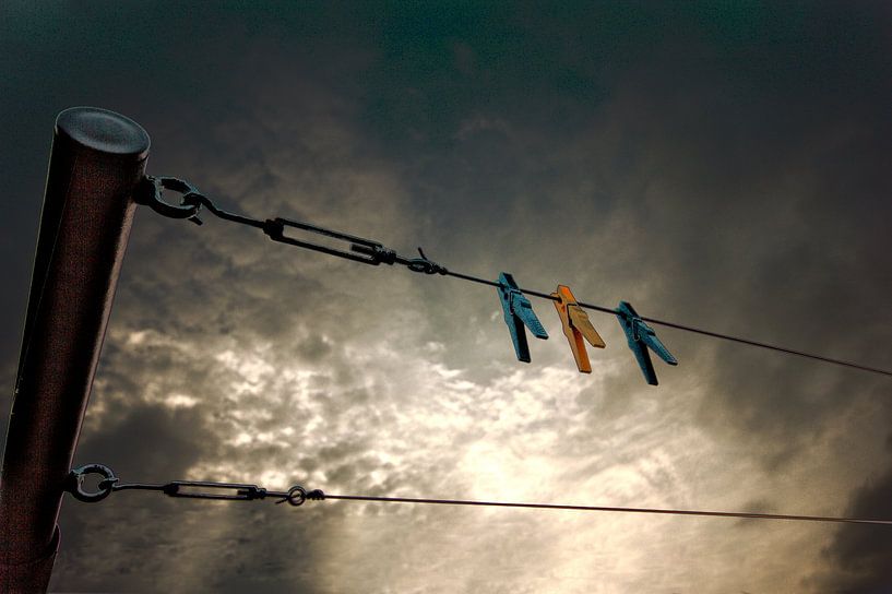 Pegs on the clothesline by Charles Verhoef