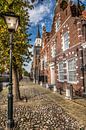 Straatbeeld van het Friese stadje Sloten in herfstkleur von Harrie Muis Miniaturansicht