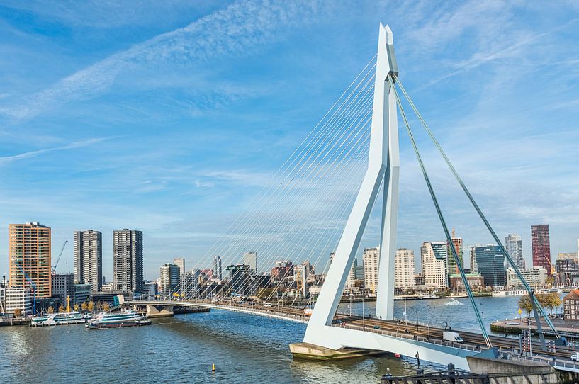 skyline of Rotterdam with the erasmus bridge over the river Maas with blue sky by ChrisWillemsen
