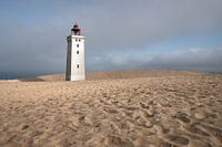 lighthouse in dune landscape