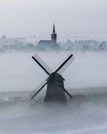 Foggy windmill near Schermerhorn in the morning by Ewold Kooistra