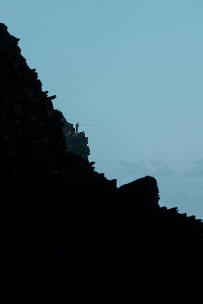 Fisherman on cliff II by Wouter Hoogeveen