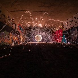Turning steel wool in an abandoned tunnel by Rianne Kugel