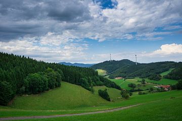 Black Forest - Wide scenic view over hilly landscape with two wind turbines by adventure-photos