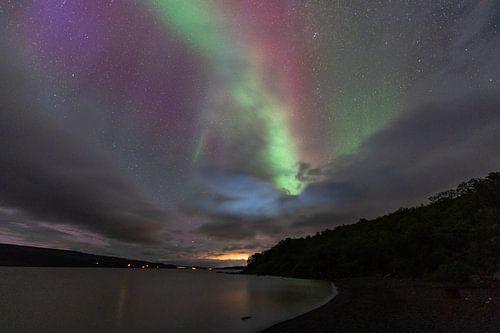 Northen light under mountains. Beautiful natural landscape in the Iceland