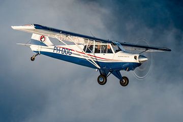 Aviat Husky plane above the clouds during sunset by Planeblogger