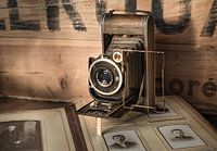 Antique camera with an old album