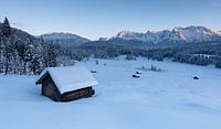 Snow-covered valley in front of the Karwendel mountains.