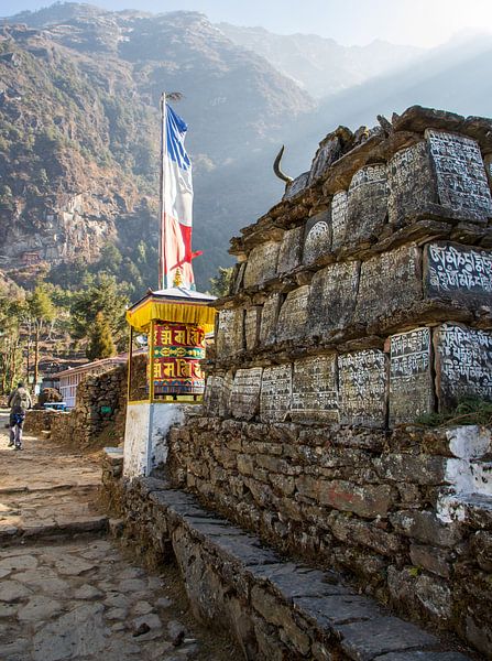 Buddhist manist rocks with holy mantras at Phakding by Ton Tolboom