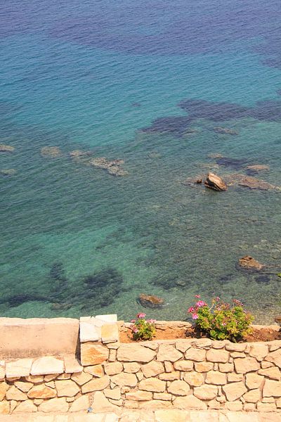 Stone bench and wall on the mediterranean sea by Bobsphotography