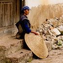 Woman with rice hat in China by Cindy Mulder thumbnail