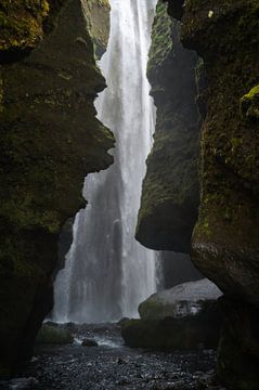 Waterfall in a cave in Iceland by Tim Vlielander