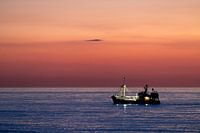 Fishing boat at sunset