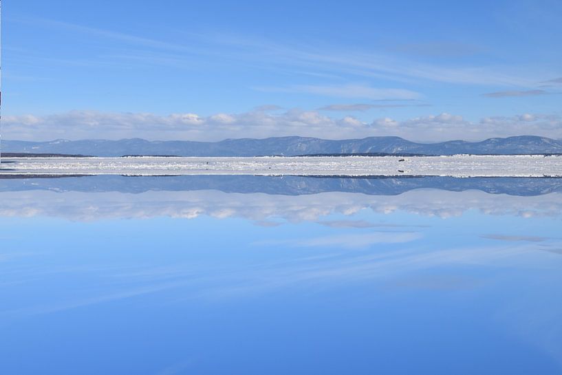 Reflections on the river in winter by Claude Laprise