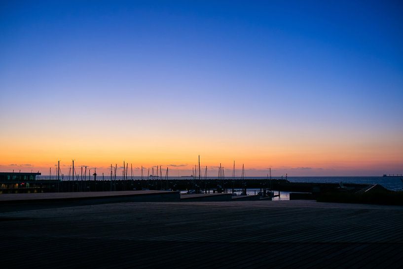 Sunset in the harbour of cadzand by Julius Koster