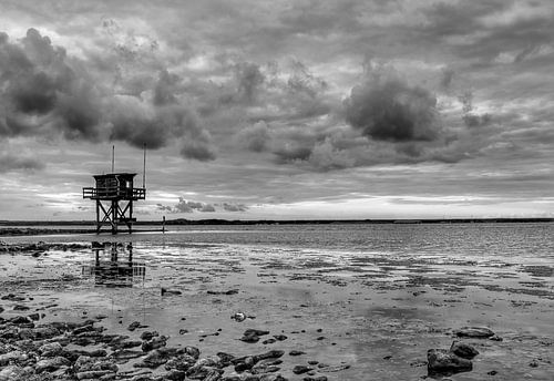 Dark clouds above harbour Scharendijke in black and white