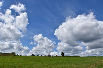 A farmhouse under a summer sky by Claude Laprise