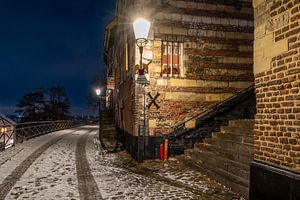Elsloo in de avond in de winter met sneeuw